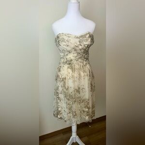 Strapless dress cream color with tulle overlay accented in gold shimmer